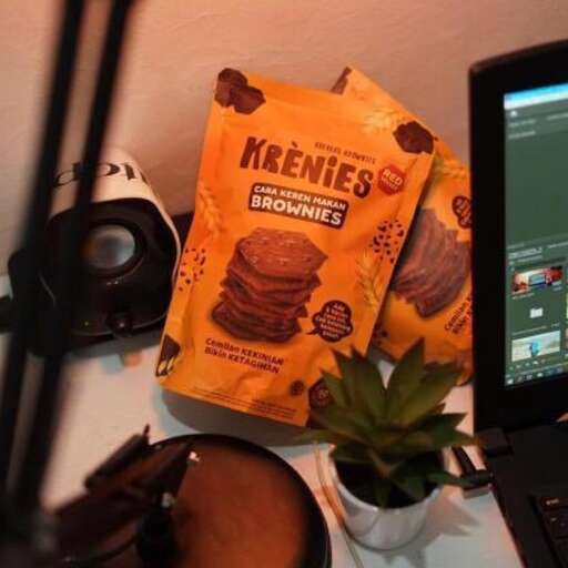 a desk with a monitor, keyboard, and a monitor.