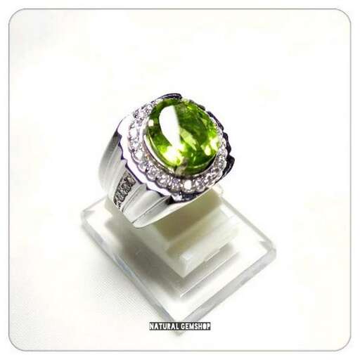 emerald and diamond ring in sterling silver with green stone
