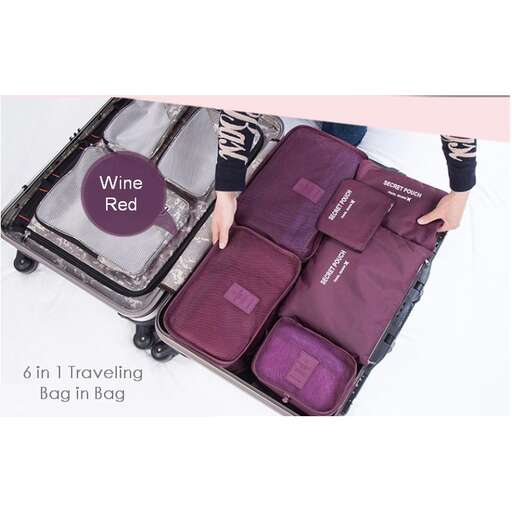 a suitcase with a red tag and a pair of hands.