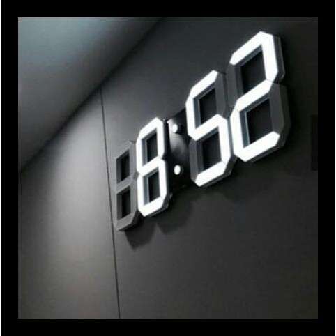 a digital clock with the time lit up.