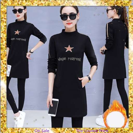 person is a long sleeved long sleeved black dress with a star on the front and a white bag in the back.