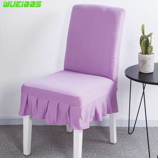 a purple chair with a white base and a black table