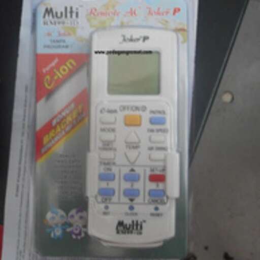 a white remote control sitting on top of a box.