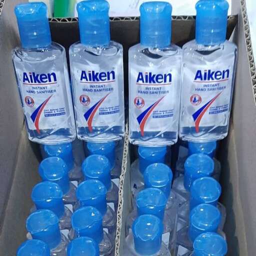 a box of water bottles with a blue cap.