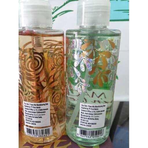 a bottle of perfume with a floral pattern.