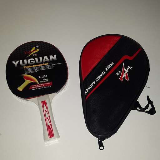 a pair of skis and a toothbrush on a table.