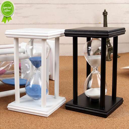 a hourglass table with a clock and a glass top.