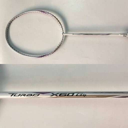 a pair of scissors sitting on top of a white surface.