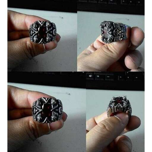a person holding a ring in their hand.