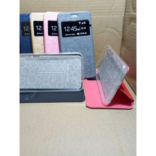 a stack of books with a clock on top of them.