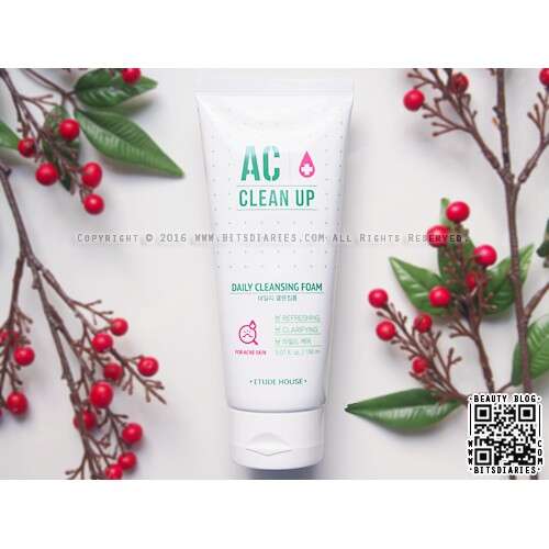 a white tube with red berries on a branch.