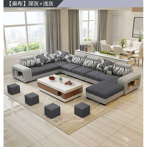 a living room with a large couch and a table.