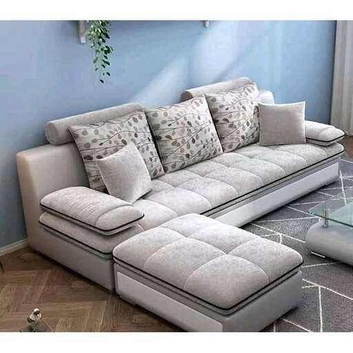 a couch with a cushioned seat and a coffee table.