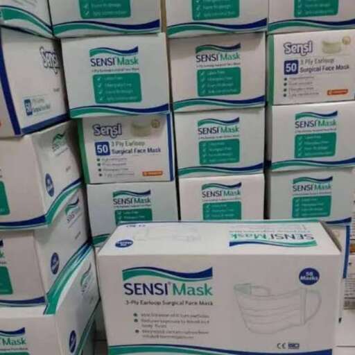 a pile of white boxes with a blue and green label.