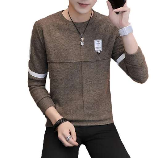 a man in a brown sweater holding a cell phone.