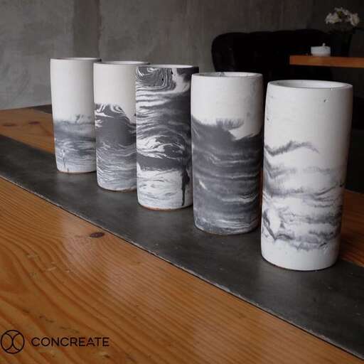 a collection of paper cups on a table.