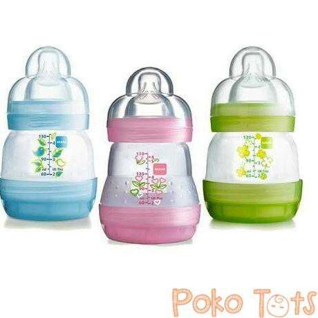 set of three glass bottles with a floral design.