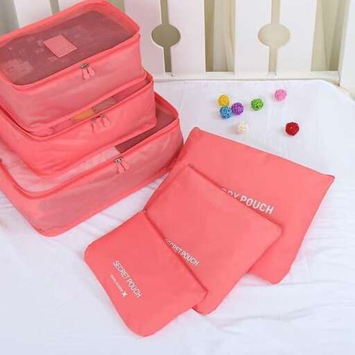 a bed with a pink bag and some toys
