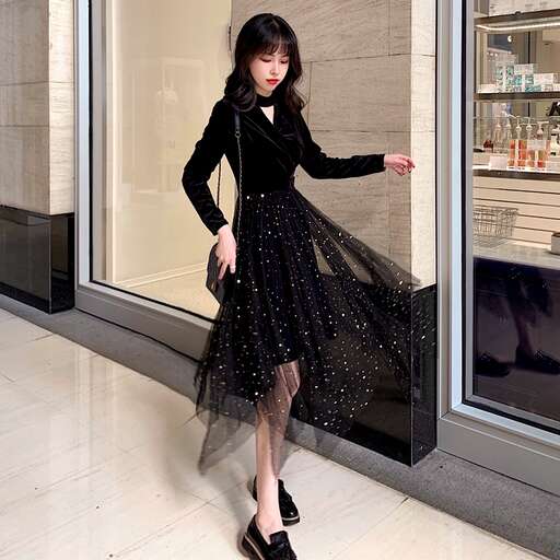 a black dress with a long skirt and a black dress