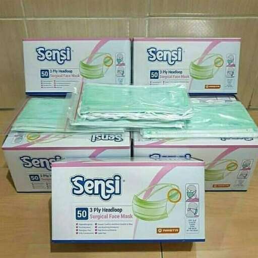 two boxes of tissues sitting on top of a counter.