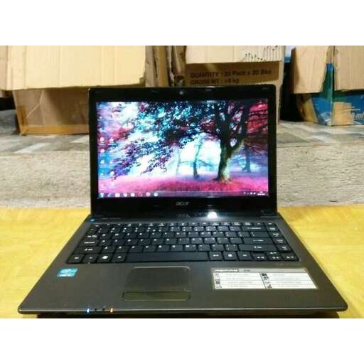 a laptop computer sitting on top of a table.