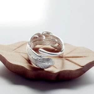 a ring with a feather inside of it