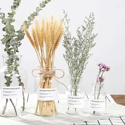 a table with several different types of flowers on it.