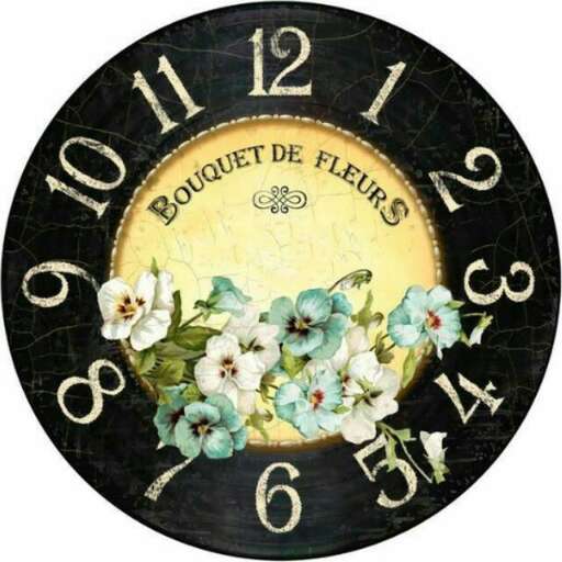 this clock is made of black and white flowers.