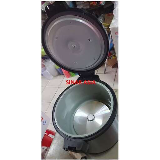 a photo of a toilet with a lid and a round light inside.