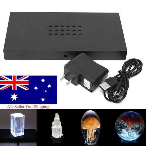 a battery charger with a plug and a battery.