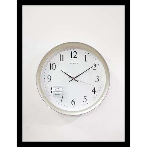 a clock with a white face and black frame.