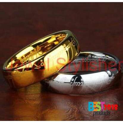a pair of gold wedding rings with a heart shaped design.
