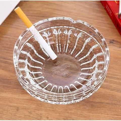 a glass bowl with a candle inside of it.