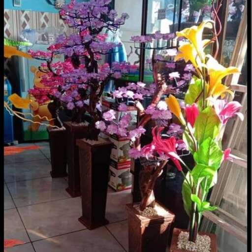 a display of flowers in a shop window.