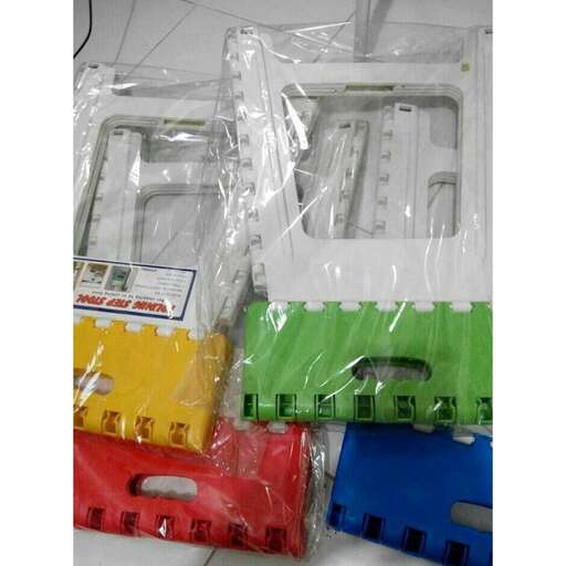 a group of plastic containers sitting on top of a white table.