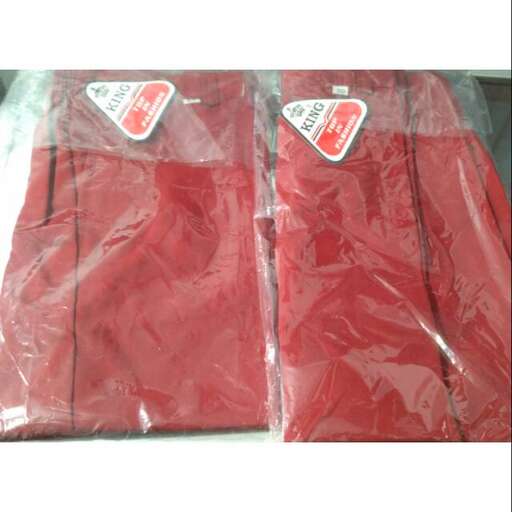 two bags of red fabric with tags on them.
