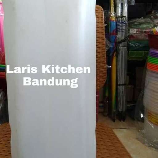 a white metal container sitting on top of a table.