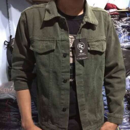 a man in a green jacket