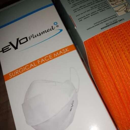 a close up of a brochure and orange cloth.