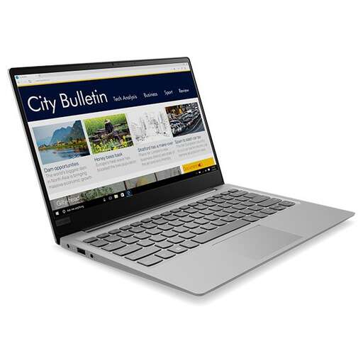 a laptop computer with a city on the screen.