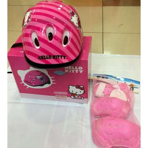 a pink helmet and a pair of pink gloves