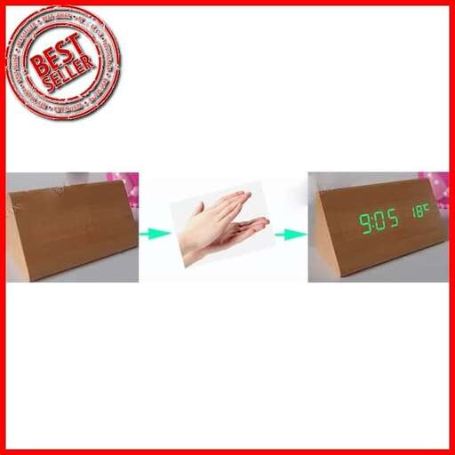 a hand holding a paper in a box