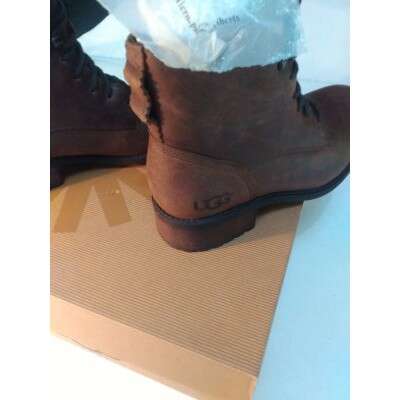 a pair of boots with a plastic bag on top of them.