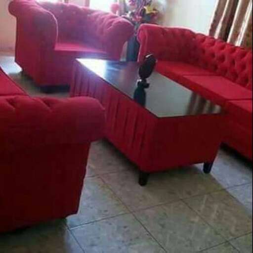 a living room with a coffee table and chairs