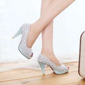 a woman's feet with a suitcase and a suitcase.