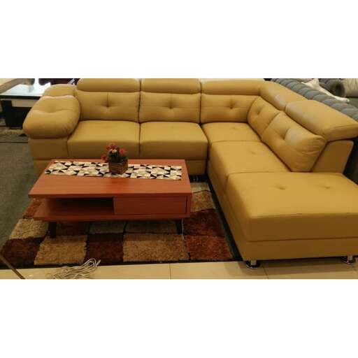 a living room with a couch, coffee table and a coffee table.