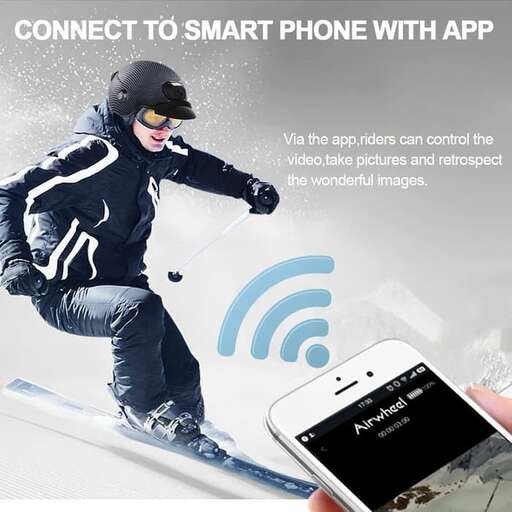 a person on skis holds a smart phone.