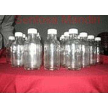 a group of empty water bottles sitting on a table.