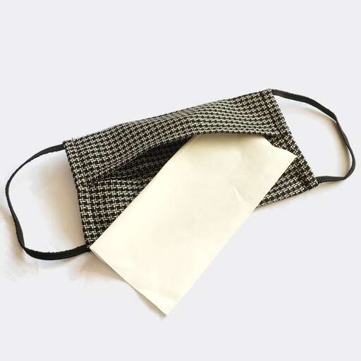 a bag with a piece of paper attached to it