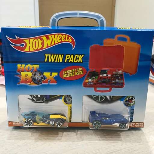 a box of brand new cars